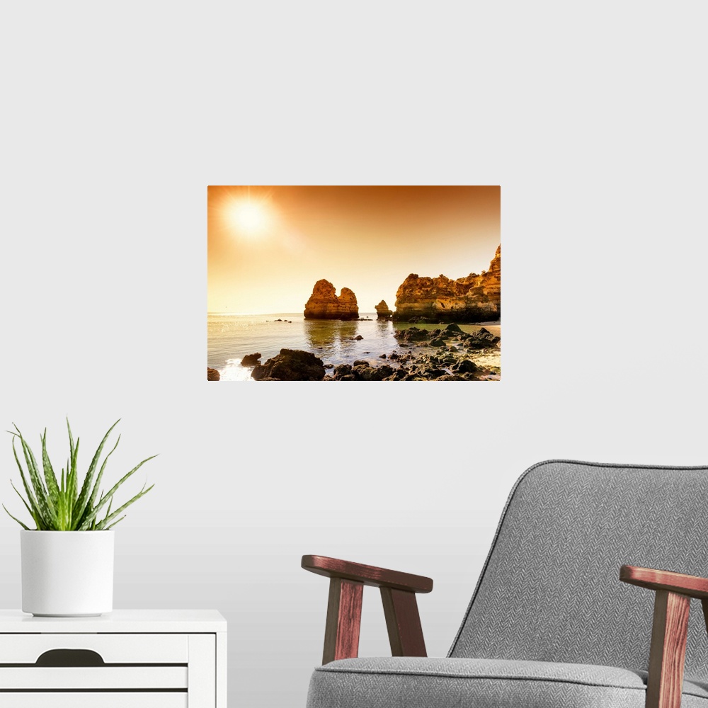 A modern room featuring It's a beautiful view of a sunset on the orange cliffs in Lagos (Portugal).
