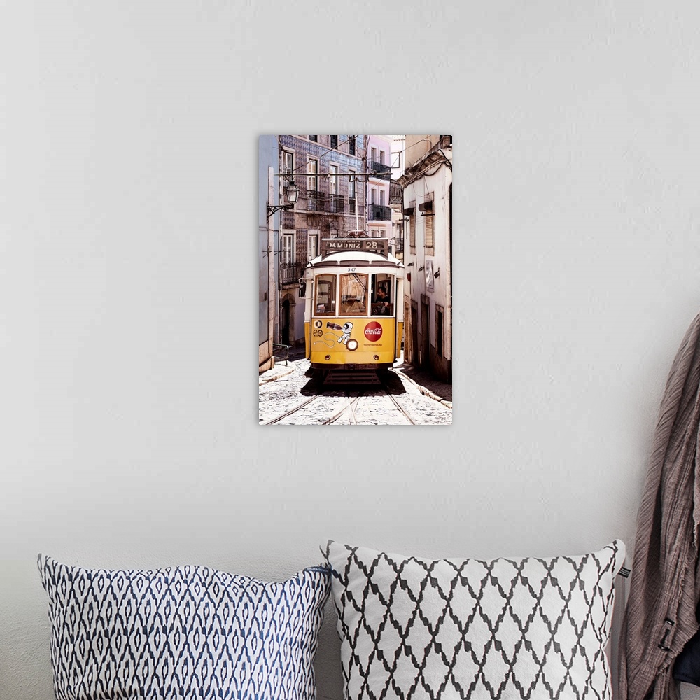 A bohemian room featuring It's a typical Lisbon street with old Facades and the famous old yellow tramway 28 in Portugal.