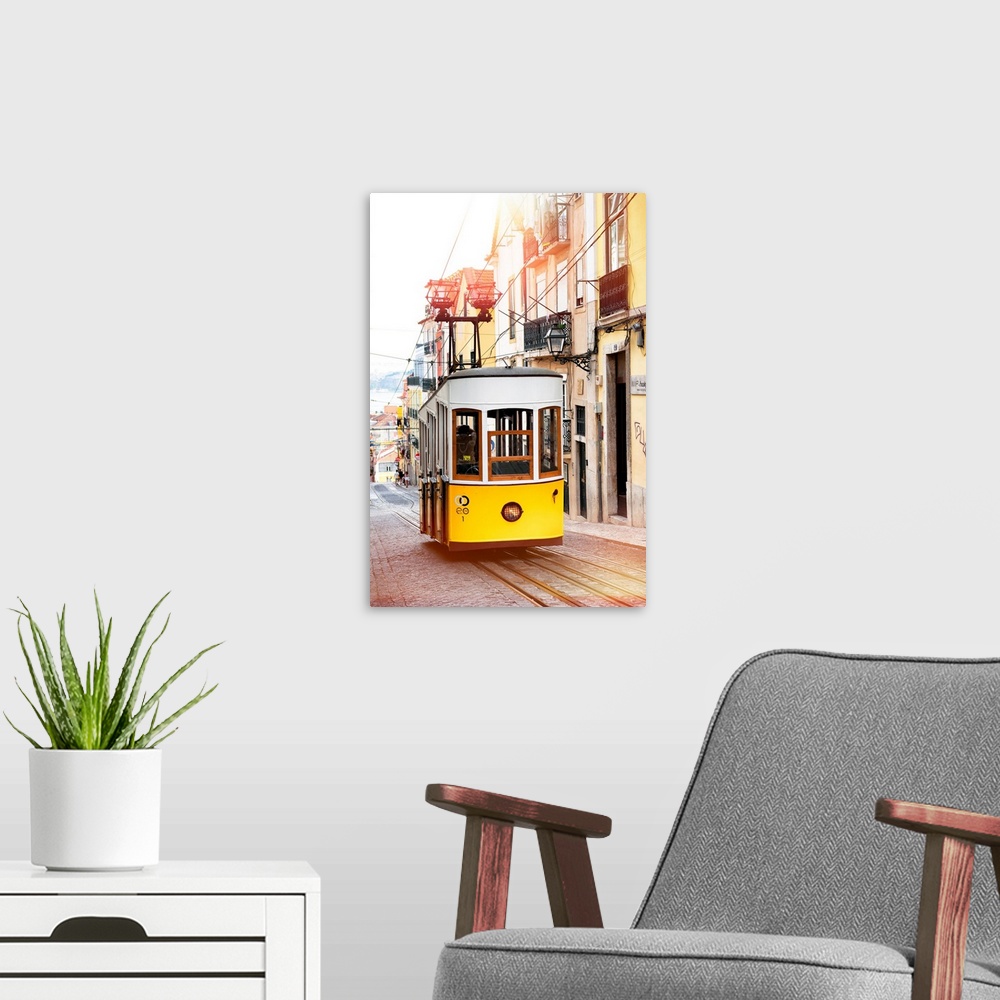 A modern room featuring It's the funicular of Bica in the district of Bairro Alto, the most symbolic yellow tram of Lisbo...