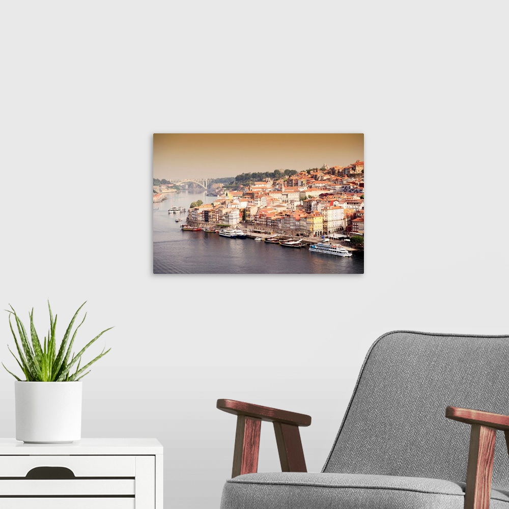 A modern room featuring It's a landscape picture at sunset of the city of Porto (Portugal) along the Douro River and the ...