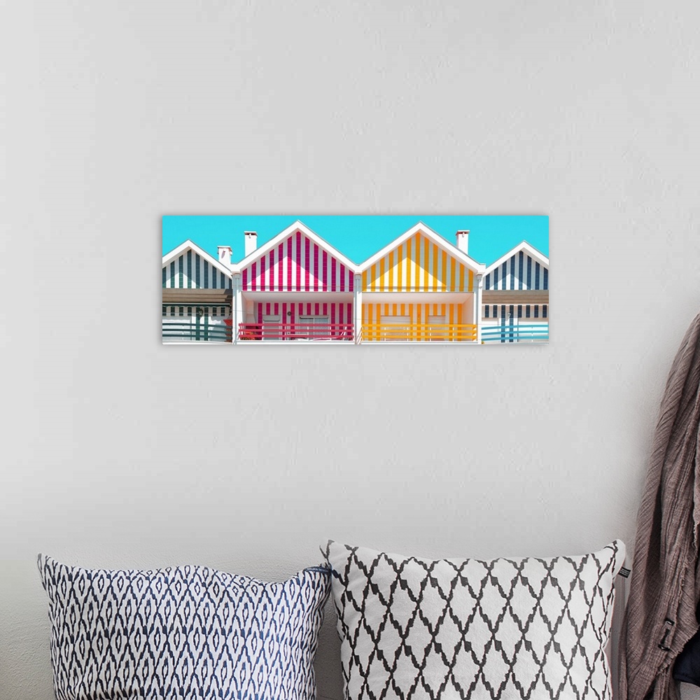 A bohemian room featuring These are four facades of colorful houses with stripes in Costa Nova Beach, Portugal.