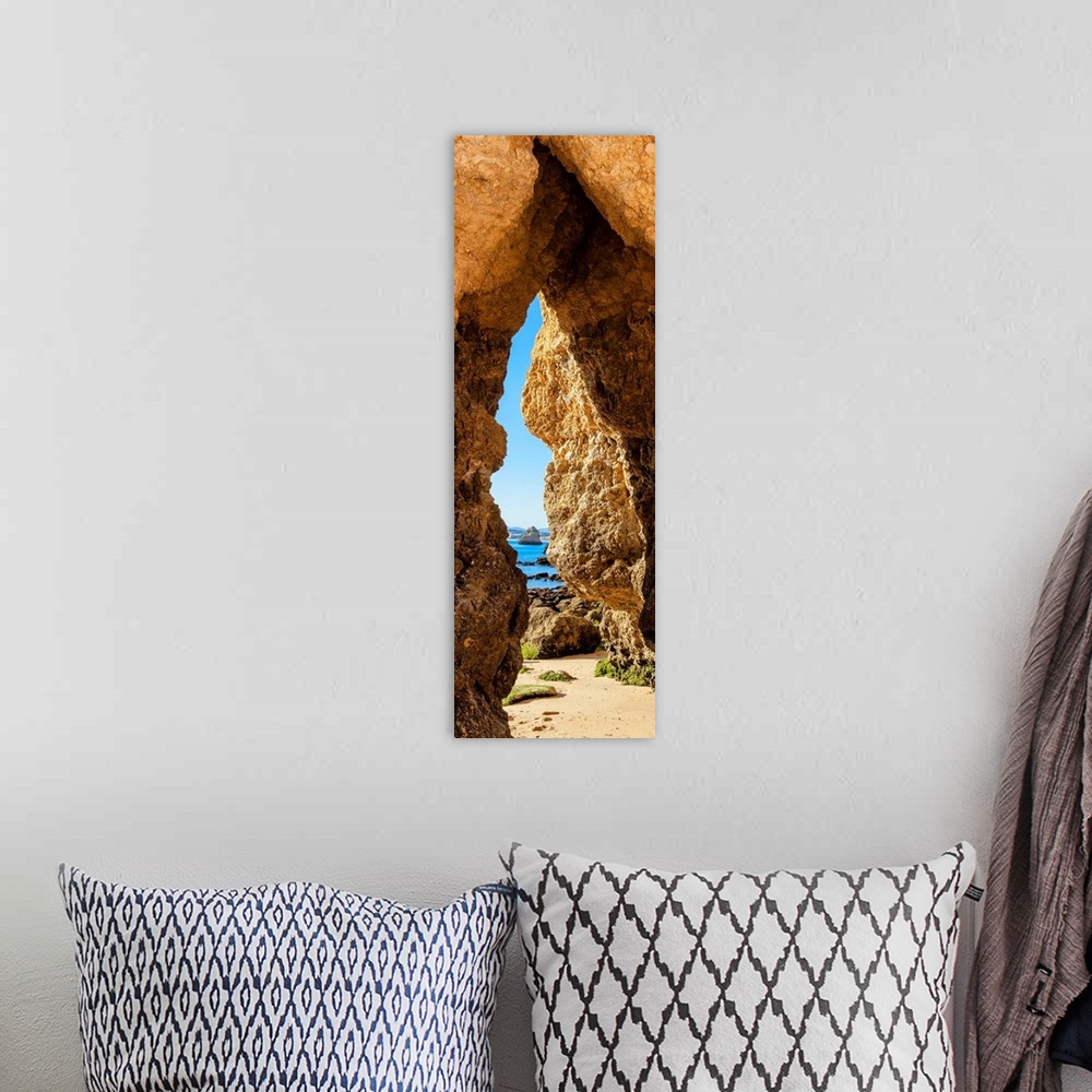 A bohemian room featuring It's a natural passage in a rock cliff on the beach of Praia do Camillo in Lagos (Portugal).