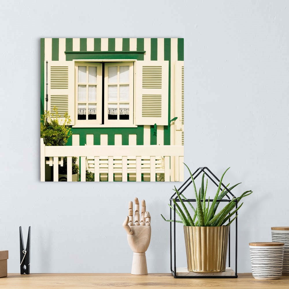 A bohemian room featuring Its' a traditional window with green stripes at Costa Nova Beach in Portugal.