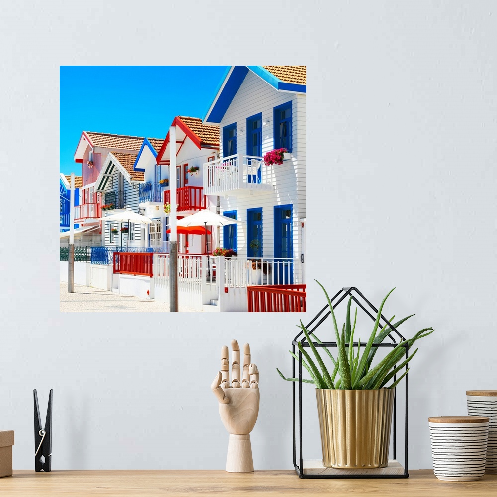 A bohemian room featuring These are colorful white houses with stripes in Costa Nova Beach, Portugal.