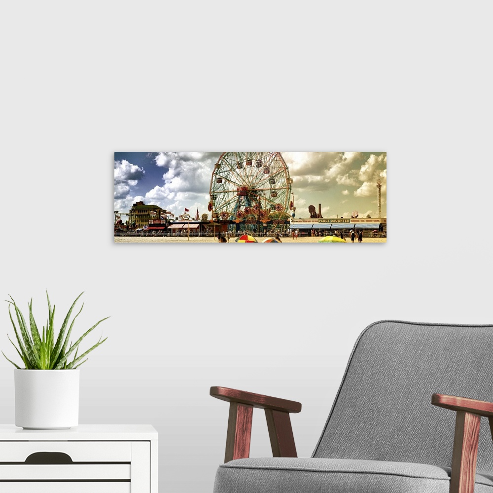A modern room featuring Panoramic photo of the large ferris wheel at Coney Island theme park in New York.