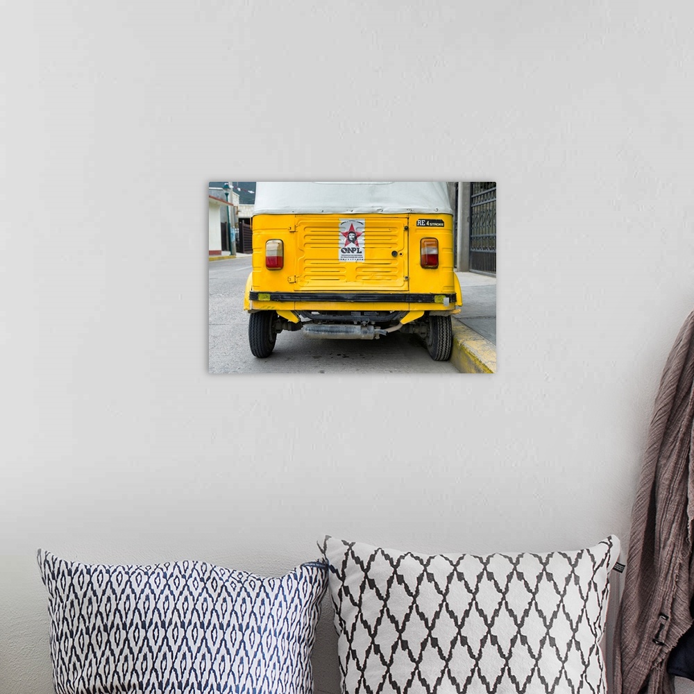A bohemian room featuring Close-up photograph of the rear side of a yellow tuk tuck (taxi) in Mexico. From the Viva Mexico ...