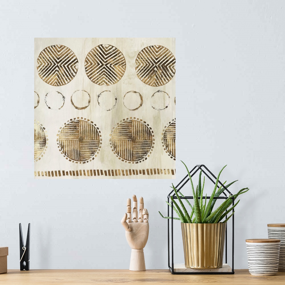 A bohemian room featuring Abstract art with metallic gold geometric circular shapes with lined designs on a light gold and ...