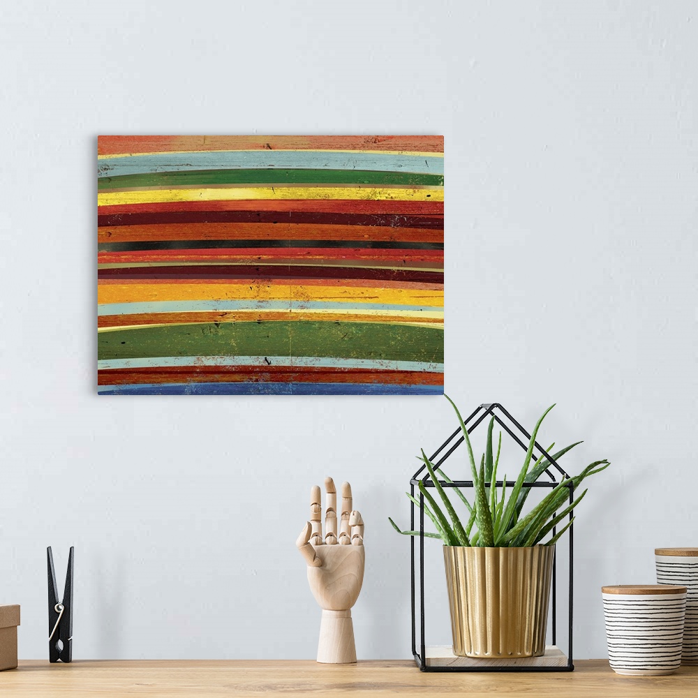 A bohemian room featuring Contemporary abstract home decor artwork of colorful horizontal stripes.