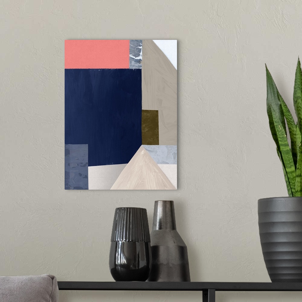 A modern room featuring Color block abstract artwork with shades of navy blue and coral pink.