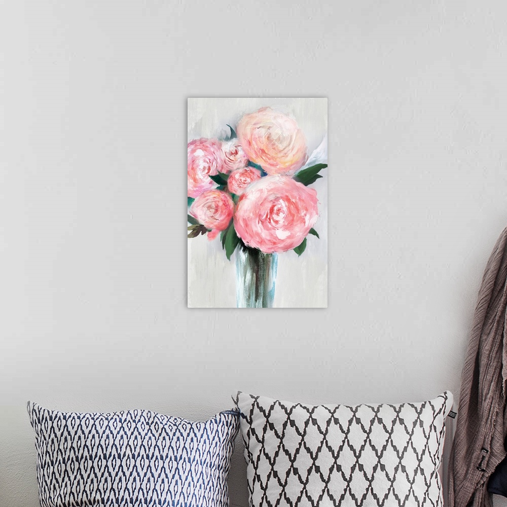 A bohemian room featuring Vertical painting of a bouquet of pink flowers in a vase.