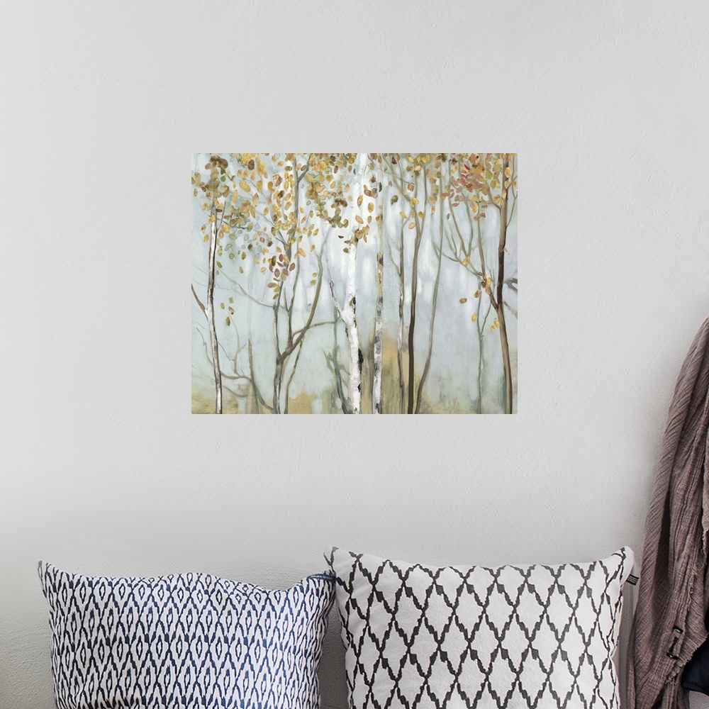 A bohemian room featuring Large landscape painting of birch trees in the woods with gold and red leaves.