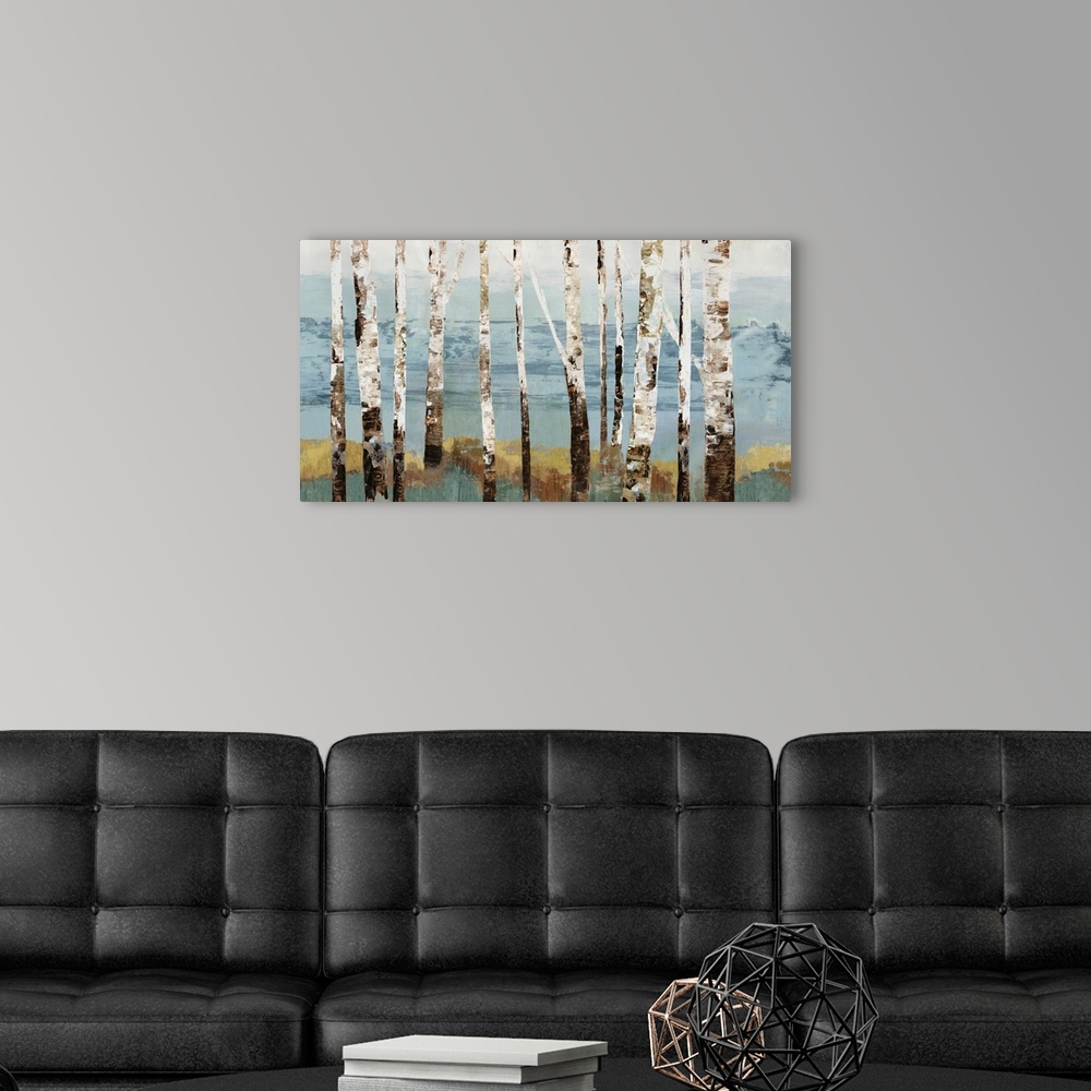 A modern room featuring Contemporary artwork of a row of white birch trees.