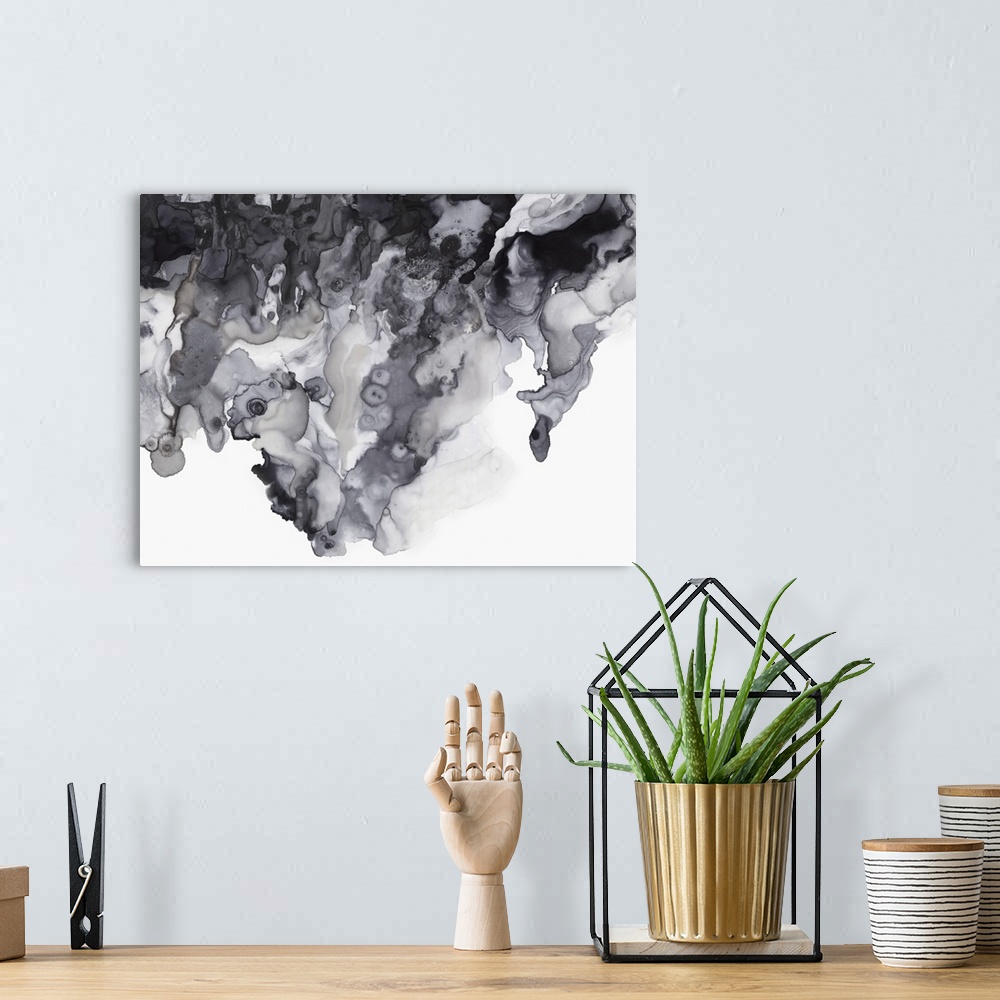 A bohemian room featuring Abstract artwork with different textured shades of gray on a white background.