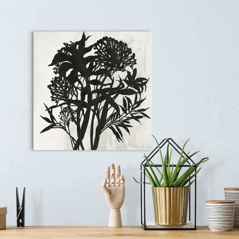 A bohemian room featuring Square painting of a flower arrangement in black and white.