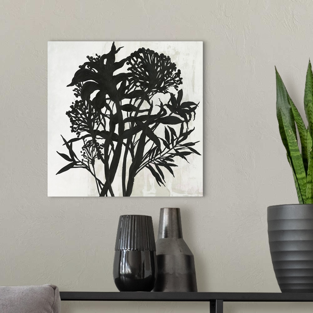A modern room featuring Square painting of a flower arrangement in black and white.