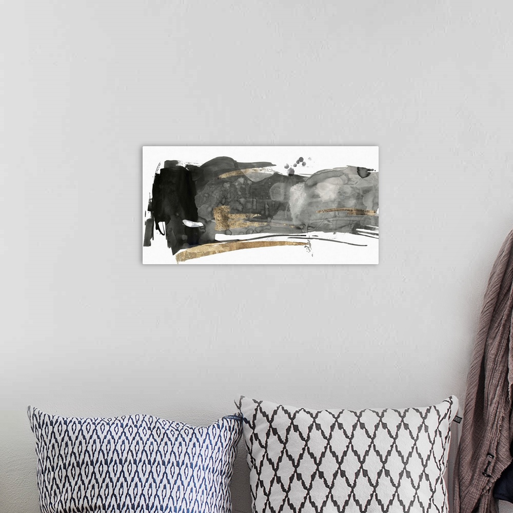 A bohemian room featuring Black and grey abstract artwork with golden streaks.