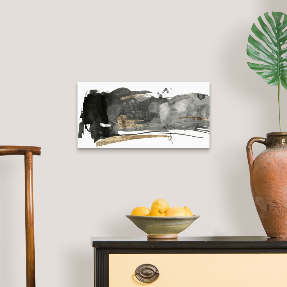 A traditional room featuring Black and grey abstract artwork with golden streaks.