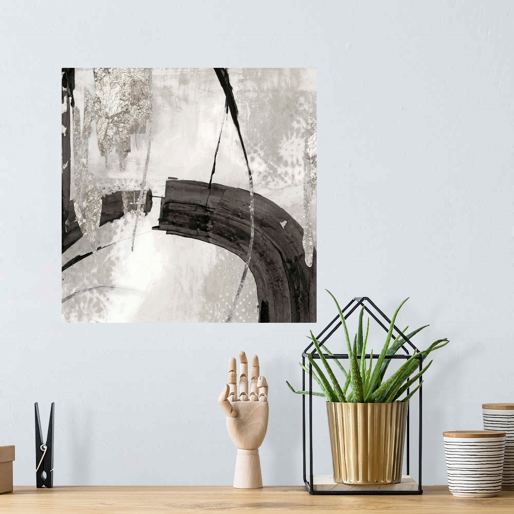 A bohemian room featuring Silver abstract artwork intersected by a black streak.