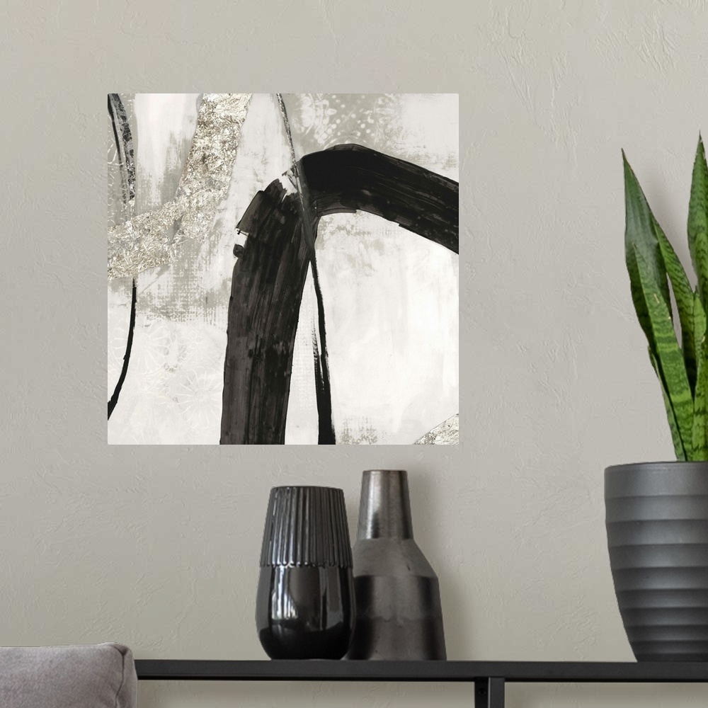 A modern room featuring Silver abstract artwork intersected by a black streak.