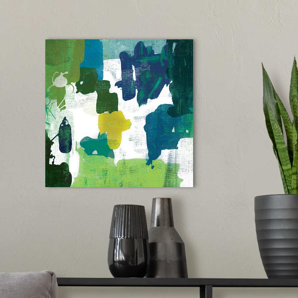 A modern room featuring A contemporary painting of abstract shapes in varies shades of green.