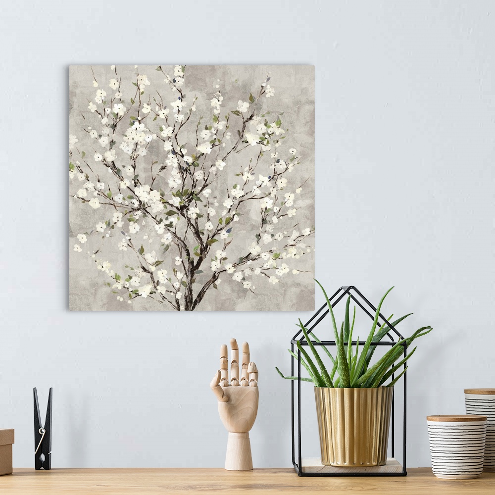 A bohemian room featuring Square painting of a tree with white blossoms all over on a gray background.