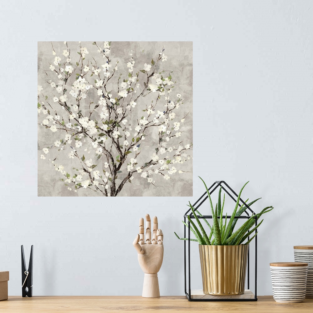 A bohemian room featuring Square painting of a tree with white blossoms all over on a gray background.