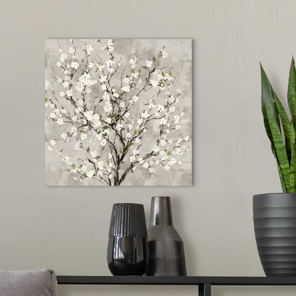 A modern room featuring Square painting of a tree with white blossoms all over on a gray background.