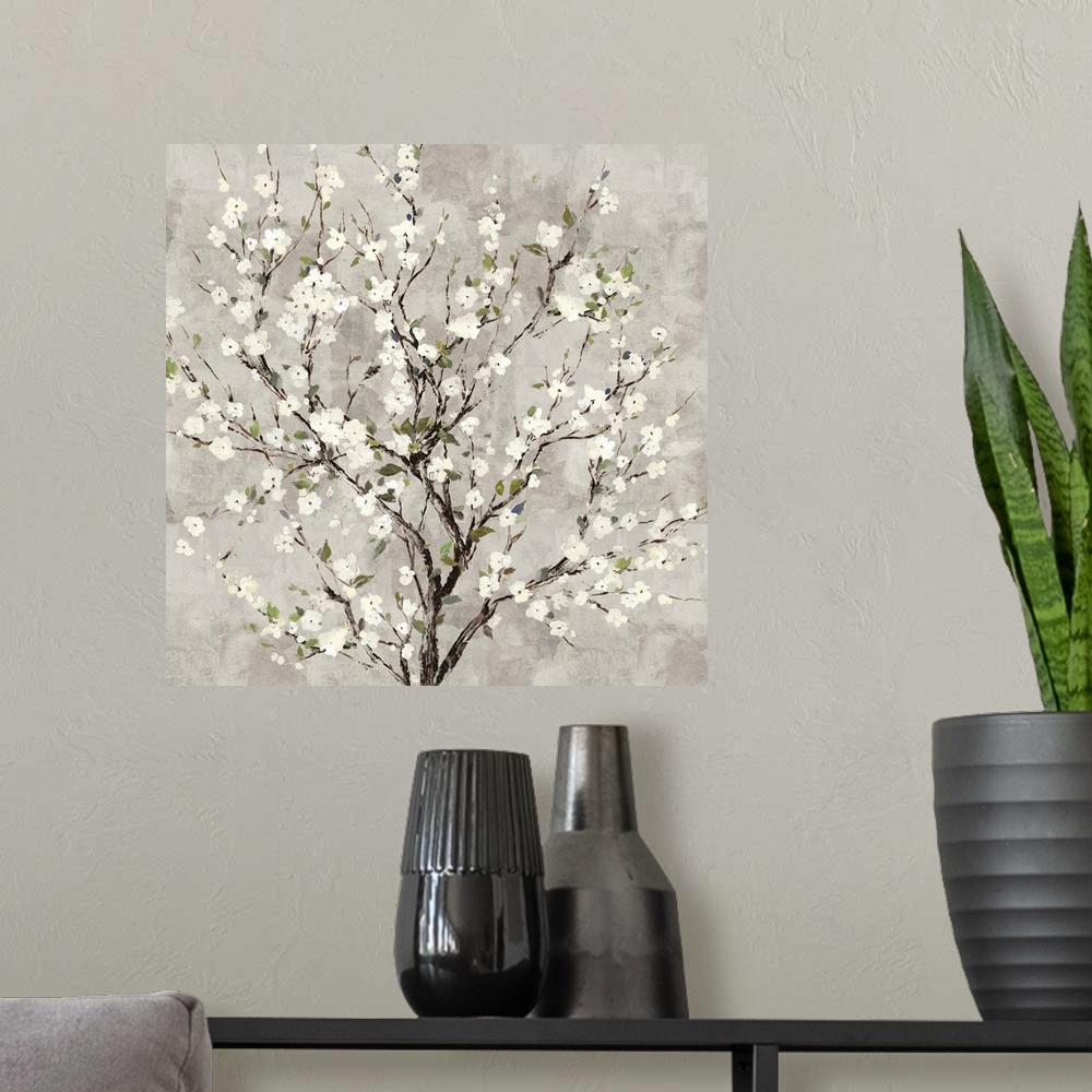 A modern room featuring Square painting of a tree with white blossoms all over on a gray background.