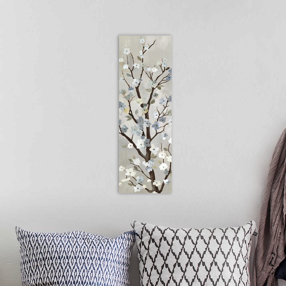 A bohemian room featuring Contemporary home decor artwork of a tree branch with white flowers in bloom.