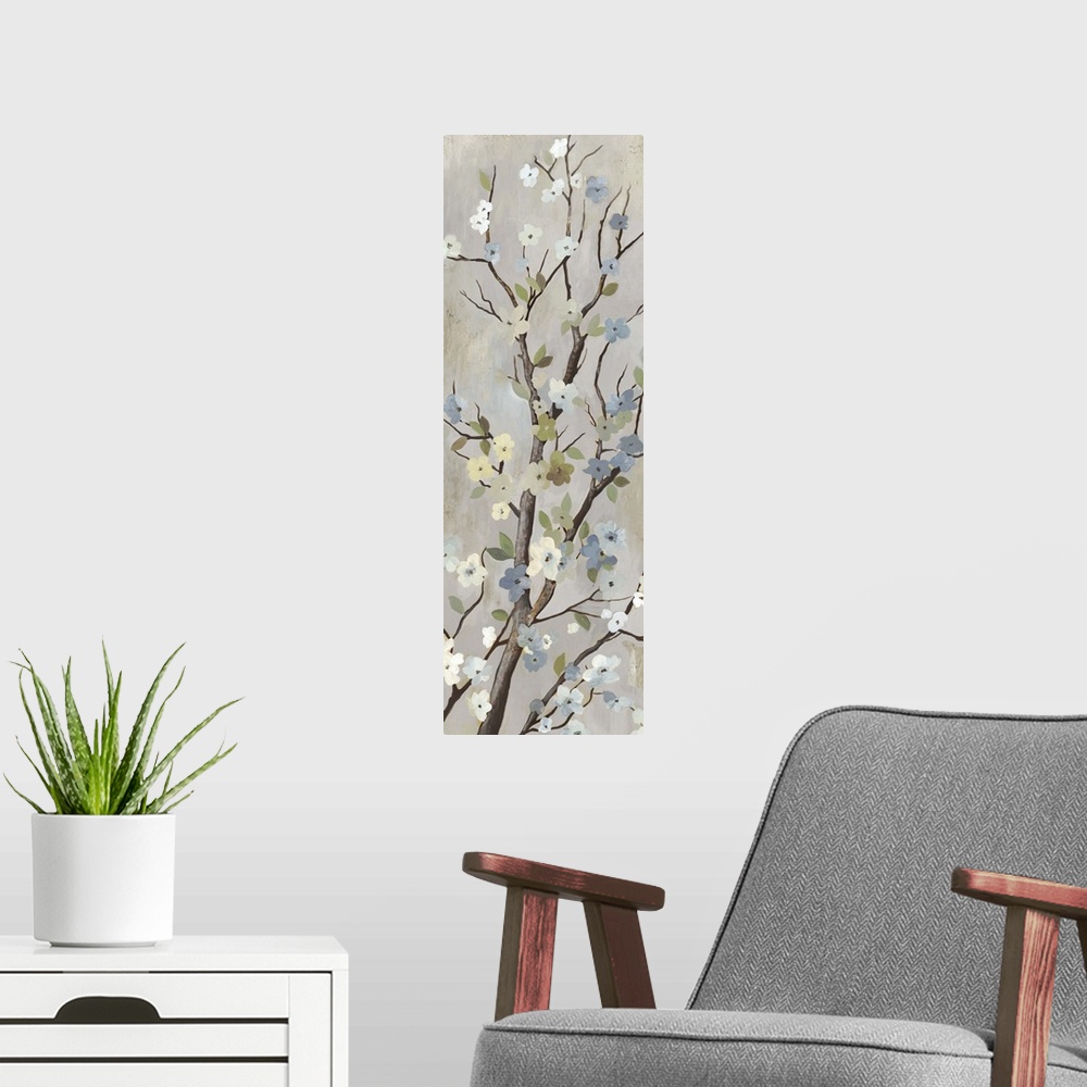 A modern room featuring Contemporary home decor artwork of a tree branch with white flowers in bloom.