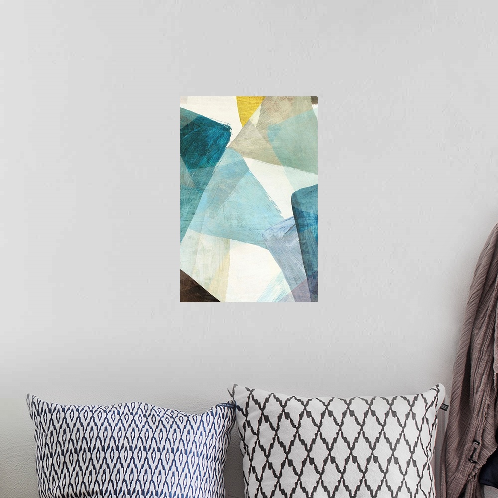 A bohemian room featuring Abstract artwork of overlapping shapes in blue and yellow tones.