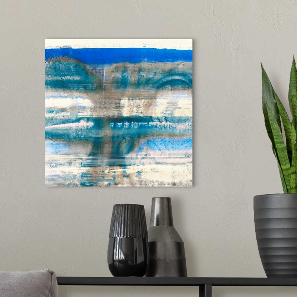 A modern room featuring Contemporary abstract home decor artwork using blue and cream tones.