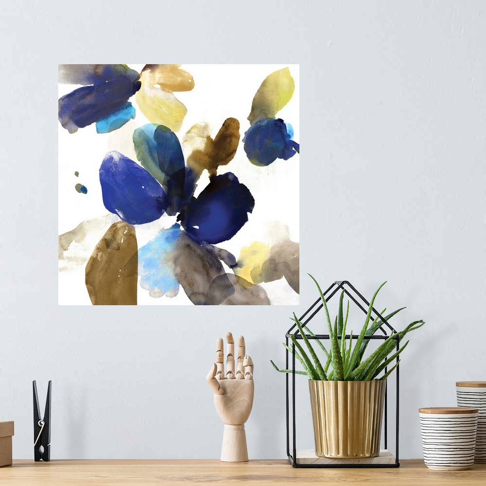 A bohemian room featuring Abstract watercolor artwork of organic blue and gold shapes on cream.