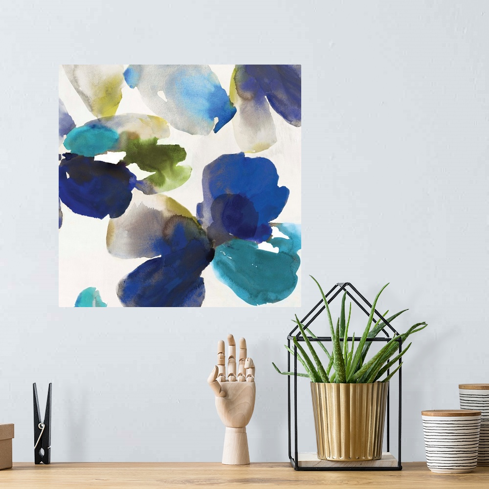 A bohemian room featuring Abstract watercolor artwork of organic blue and turquoise shapes on cream.
