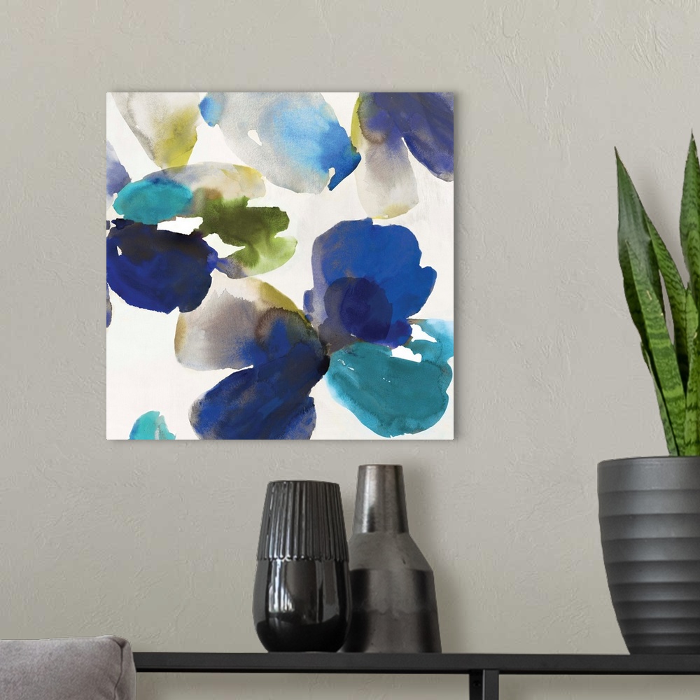 A modern room featuring Abstract watercolor artwork of organic blue and turquoise shapes on cream.