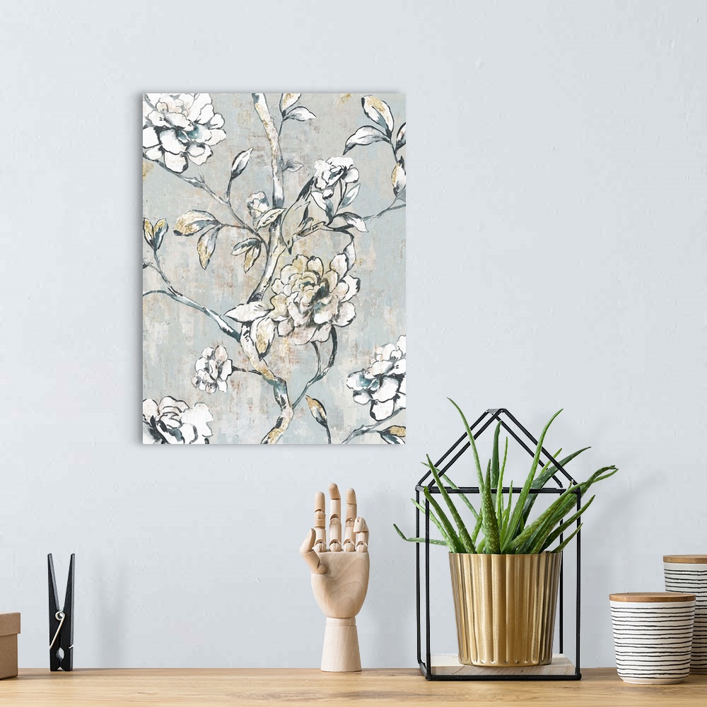 A bohemian room featuring A contemporary painting of white flower blooms on leaf covered stems against a neutral textured b...