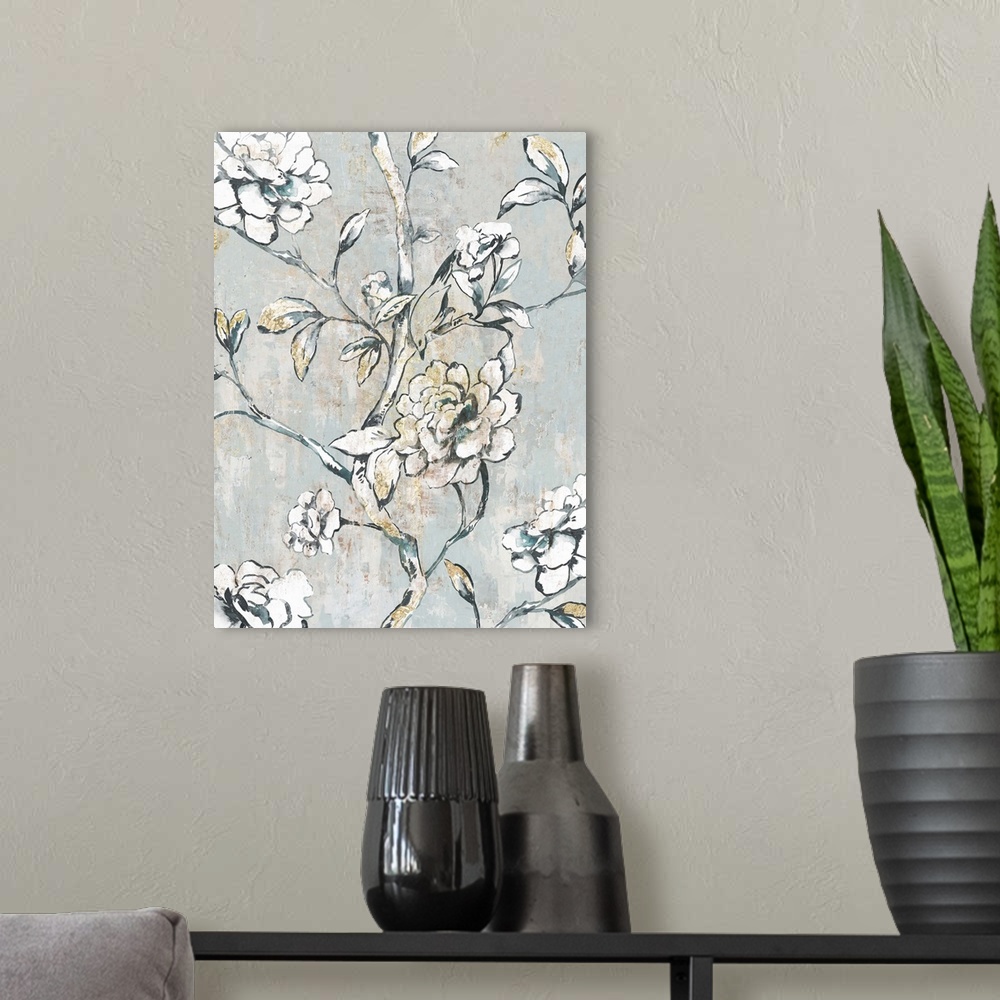A modern room featuring A contemporary painting of white flower blooms on leaf covered stems against a neutral textured b...