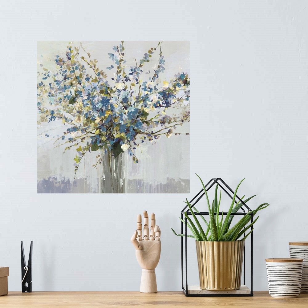 A bohemian room featuring Contemporary artwork of a vase full of blue and white flowers.