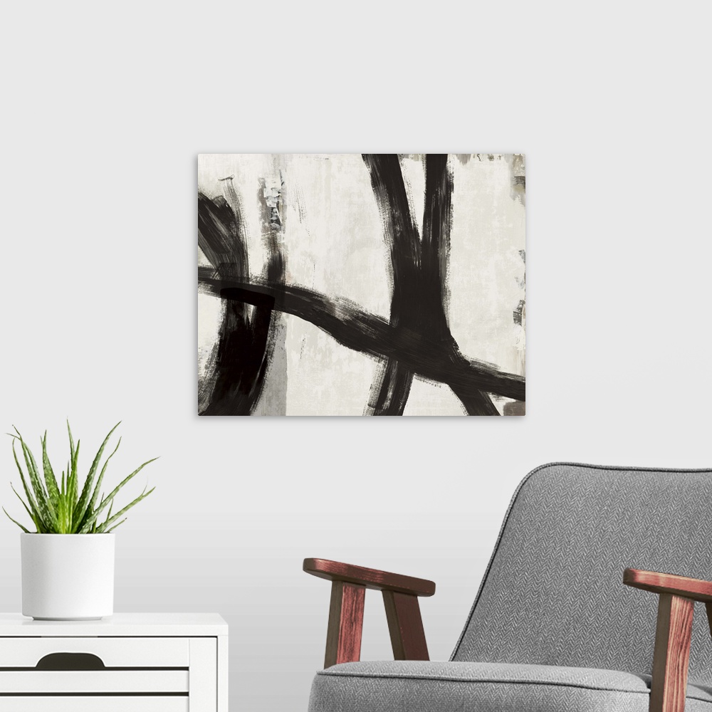 A modern room featuring Abstract artwork of dark black strokes over cream and grey.