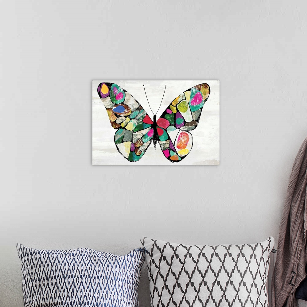 A bohemian room featuring Decorative wall art with an illustration of a colorful butterfly with mosaic-like wings.