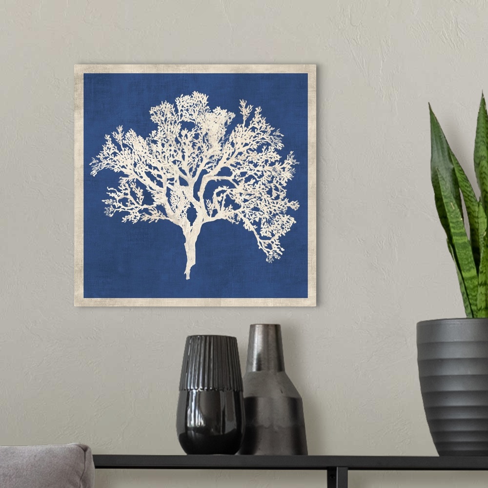 A modern room featuring Contemporary home decor artwork of white coral against a weathered blue background with a white b...
