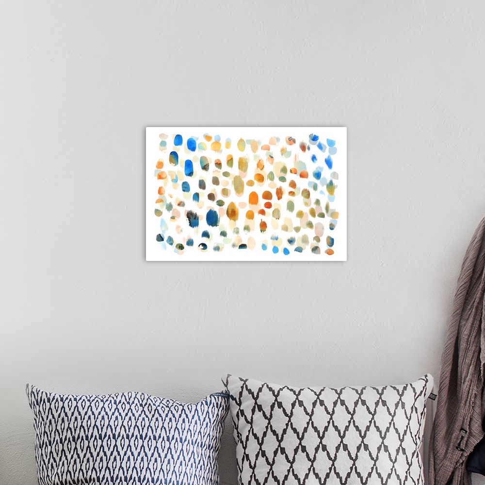 A bohemian room featuring Abstract artwork made of multicolored dots in watercolor paint on white.