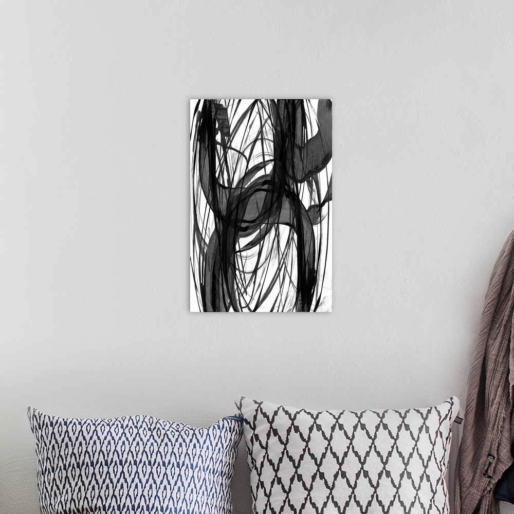 A bohemian room featuring Vertical abstract of varies overlapping rings of black in different widths.