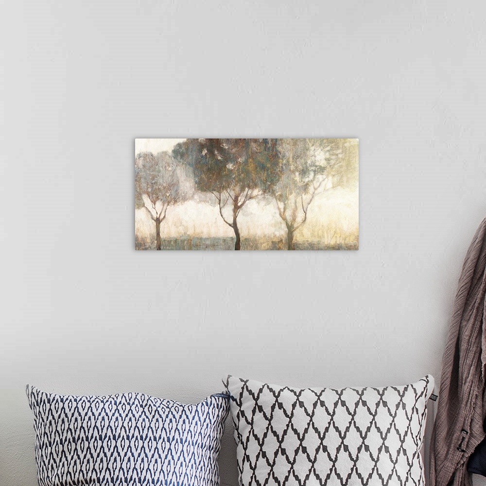 A bohemian room featuring Contemporary artwork of trees on a misty morning.