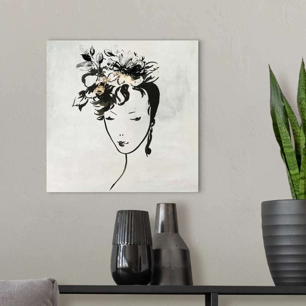 A modern room featuring Portrait of a female outlined in black with gold accents against a neutral backdrop.