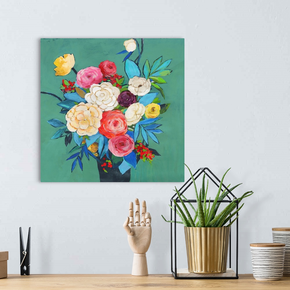 A bohemian room featuring Brightly colored floral bouquet on a teal background.