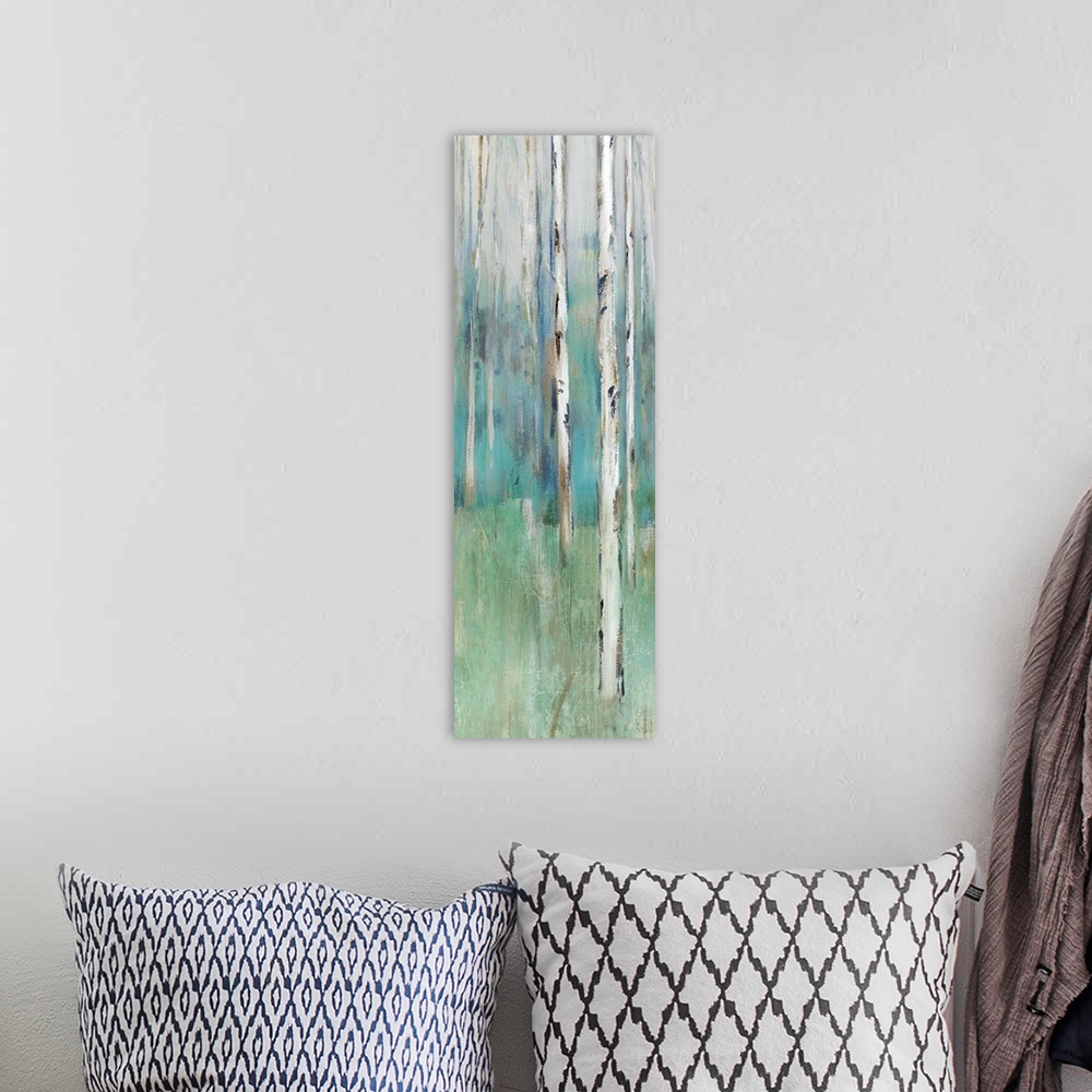 A bohemian room featuring Abstract painting of a forest in muted blues and greens.