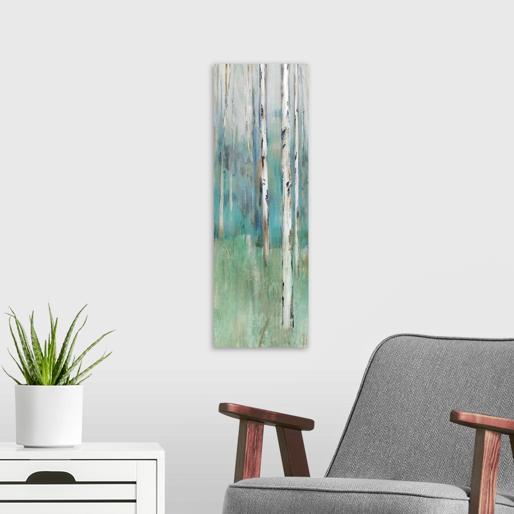 A modern room featuring Abstract painting of a forest in muted blues and greens.