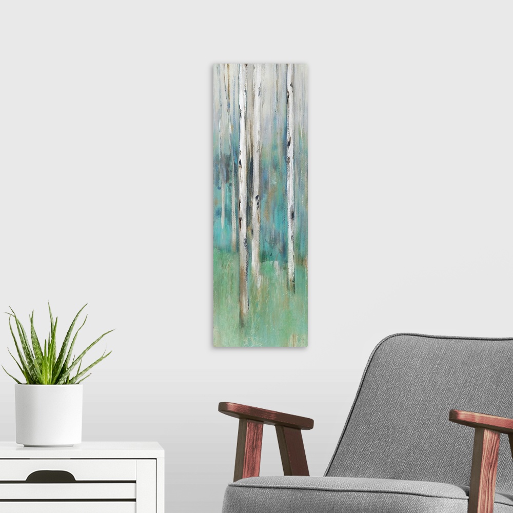 A modern room featuring Abstract painting of a forest in muted blues and greens.
