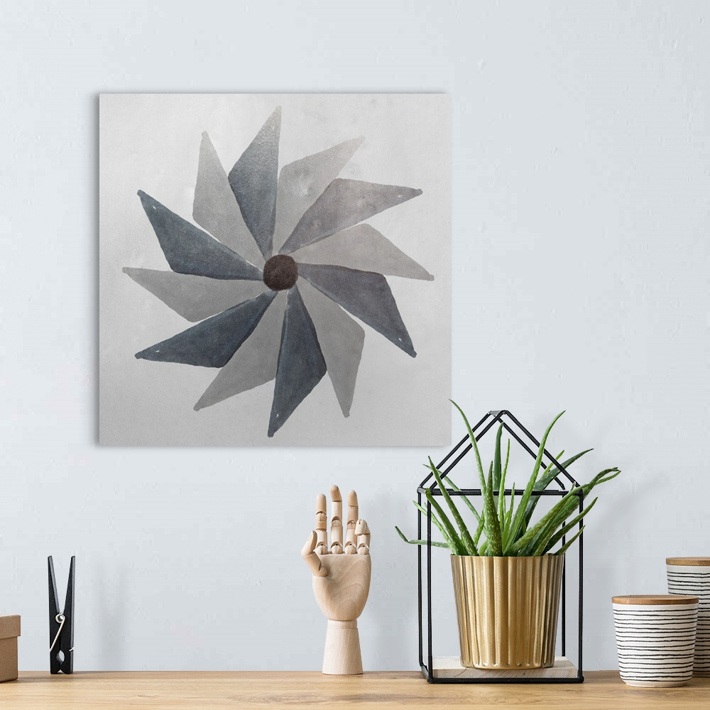 A bohemian room featuring Abstract pinwheel shape in shades of grey.